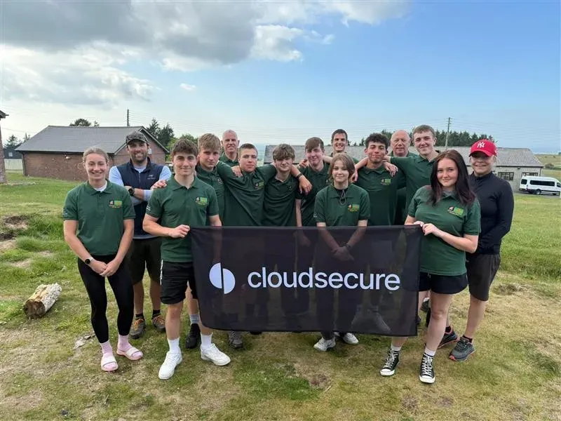 The cadets at the end of the march holding the clousecure flag